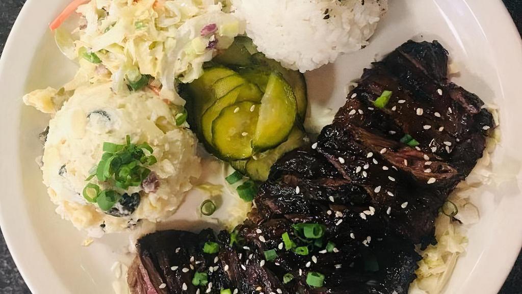 Guava Skirt Steak Plate · Skirt Steak marinated in Guava puree, gluten free soy sauce, ginger. Served with white rice, potato-macaroni salad.