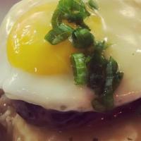 Loco Moco · Ground Beef patty, carmelized Maui onion gravy, sunny side up egg and 2 scoops of white rice.