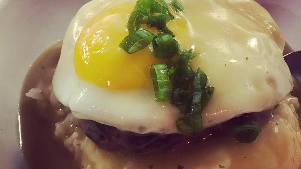 Loco Moco · Ground Beef patty, carmelized Maui onion gravy, sunny side up egg and 2 scoops of white rice.