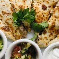 Kalua Pig Quesadilla · Flour tortilla with slow roasted kalua pig and Monterey-Cheddar cheese blend. Served with ci...