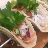 Kalua Pig Tacos · (3 count). Slow Roasted Pulled Pork. Deconstructed with guacamole, pineapple salsa, island s...