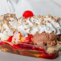 Banana Special · A whole banana, WITH YOUR (THREE) CHOICE  of ice cream.
Toppings :hot fudge, strawberry, pin...