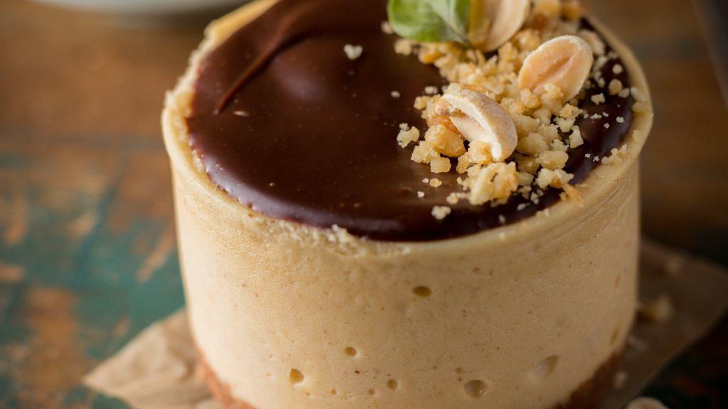 Peanut Butter Dream Cheesecake · Our creamy peanut butter cheesecake is like heaven on your fork crispy chocolate crust and creamy center with cover in chocolate ganaché topped with salted peanuts.