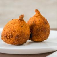 Coxinha · Fried dough filled with chicken, potato and onion.