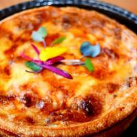 Large Family Quiche · Choice of one quiche. Meal served with  a Salade Verde. Mix green, fennel, celery, chery, to...
