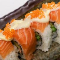SA16. Salmon Paradise · Tempura salmon, tempura asparagus on topped with salmon sashimi and lion king sauce, tobiko.