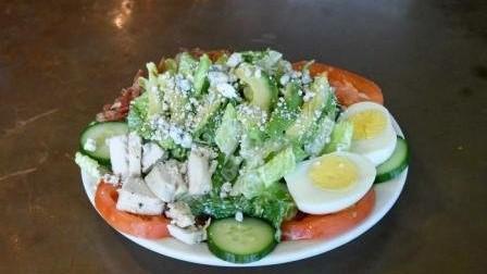 5. Cobb Salad · Chicken breast, bacon, tomato, cucumber, avocado, hard boiled egg, blue cheese crumbles on chopped lettuce with blue cheese dressing.
