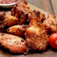 Tangy BBQ Wings · Sweet & tangy barbeque sauce smothered on oven-baked chicken wings! Served with Ranch.
