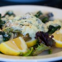 Oysters Rockefeller · Fresh oysters with butter, garlic, spinach, cream and roman cheese