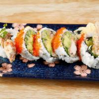 Spider Roll · Deep fried soft shell crab, avocado, cucumber, and tobiko.