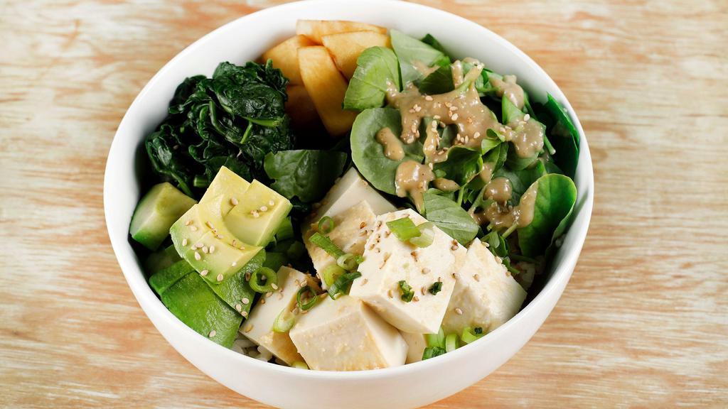 Miso Zuke Tofu · Miso marinated silken tofu, watercress salad + sesame miso dressing, avocado, spinach + pickles over rice.