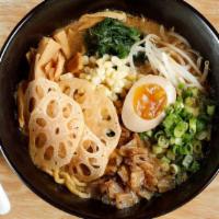 Veggie Miso Ramen · Stewed fennel, lotus root, corn, bean sprouts, green onion, spinach, and half egg. Rich vege...