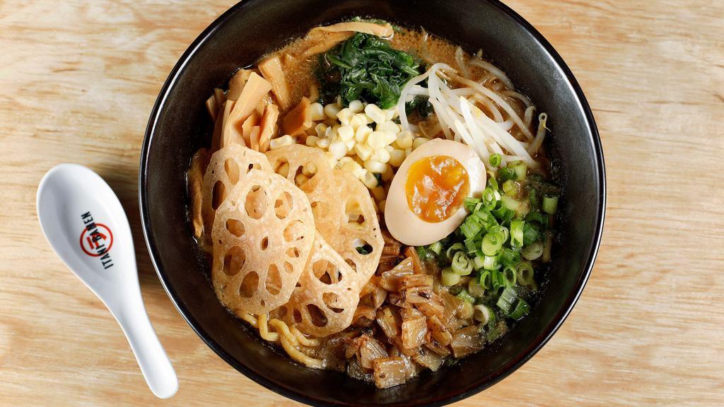 Veggie Miso Ramen · Stewed fennel, lotus root, corn, bean sprouts, green onion, spinach, and half egg. Rich vegetarian sesame miso broth.