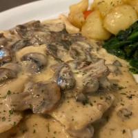 Pollo ai funghi · pan seared chicken breast in mushroom creamy sauce, served with roasted broccoli & medley po...