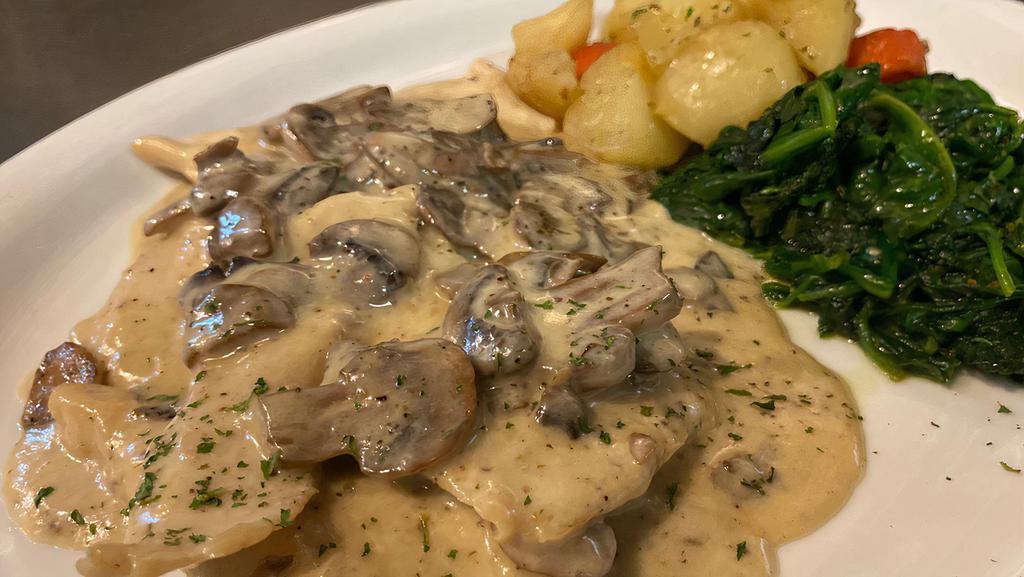 Pollo ai funghi · pan seared chicken breast in mushroom creamy sauce, served with roasted broccoli & medley potatoes.