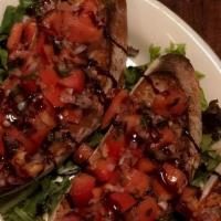 Bruschetta · Rustic Italian bread toasted and topped with marinated roma tomatoes, red onion, olive oil a...