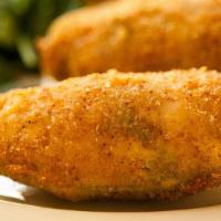Chile Poppers · Six cream cheese-stuffed Jalapeño peppers, dipped in spicy breading and fried golden crisp. ...
