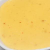 Cheese Dip · Our home made cheese dip made with queso blanco, diced Jalapeño peppers, and our secret spic...