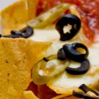 Nachos · Crisp corn tortilla chips piled high and smothered with a blend of melted cheese, your choic...