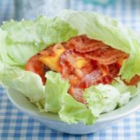 Lettuce Hamburger Wrap · No bun. Hamburger patty with tomatoes, onions and dressing. Served wrapped in lettuce.