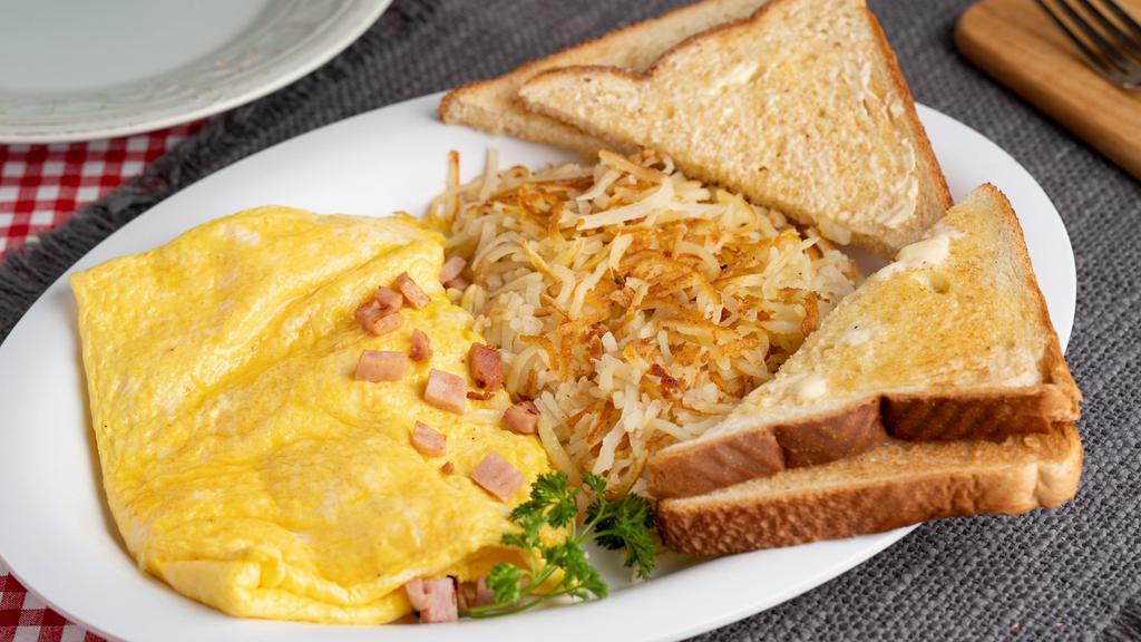 Meat & Cheese Omelet (A La Carte) · 3 extra-large AA grade eggs served with choice of meat and 2 thick slices of cheese.