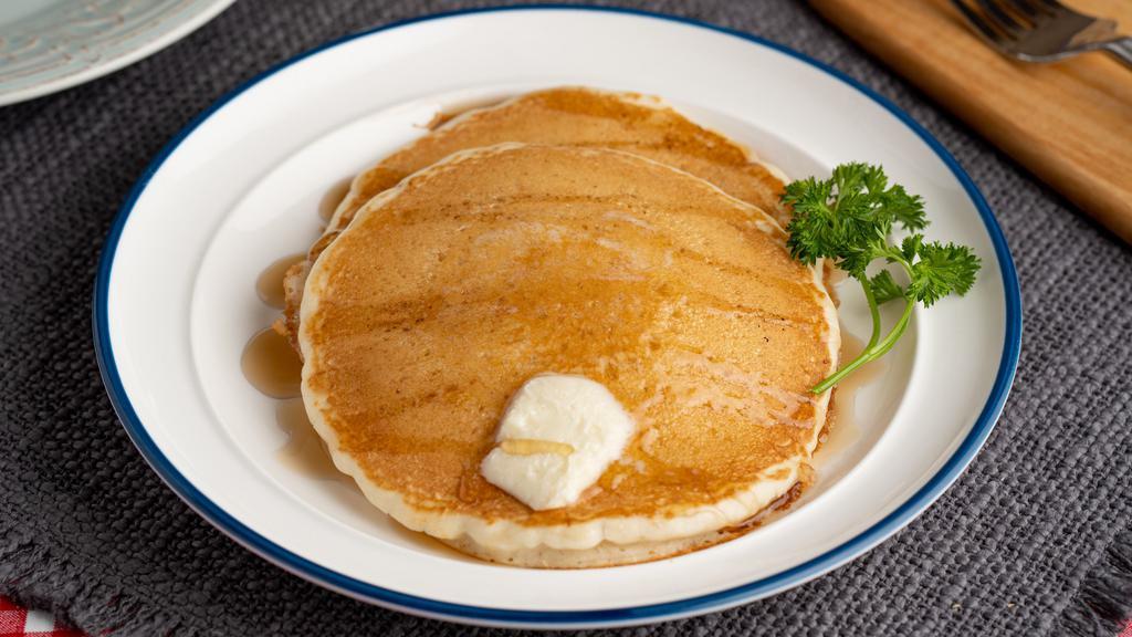 Two Pancakes · 2 fluffy pancakes served with butter and syrup.