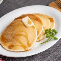 Four Pancakes · 4 fluffy pancakes served with butter and syrup.