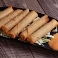 Lumpia (6 Pc) · Filipino style mini egg rolls filled with pork and veggies. Comes with a side of sweet and s...
