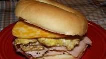 4. Deli Sandwich Bagel · Toasted, plain bagel with mayo, mustard, lettuce, onion, pickle, tomato, American cheese and...