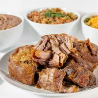 Carnitas Family Pack · Slow cooked pork. Crispy on the outside and moist and tender on the inside.  Comes with side...