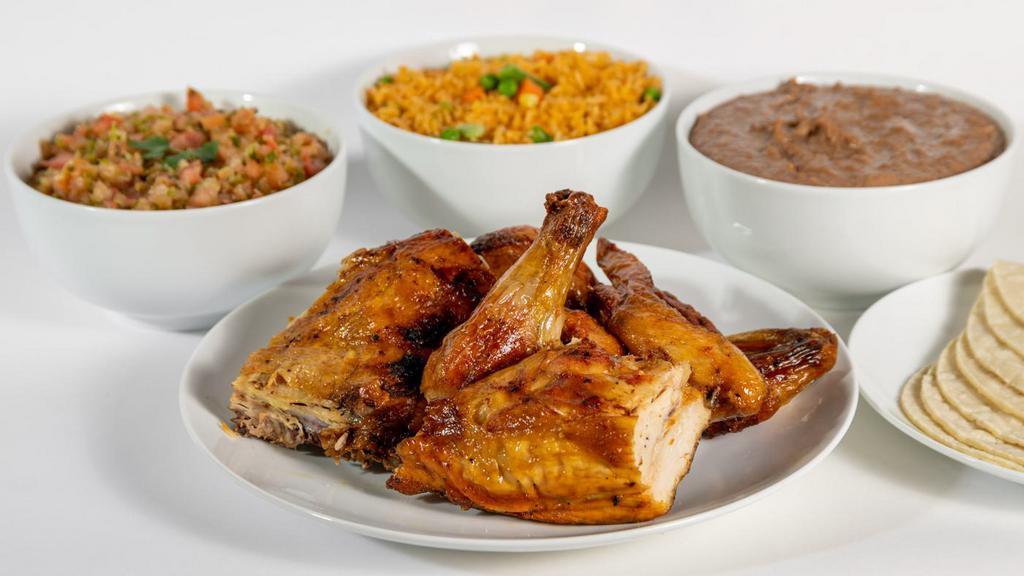 Chicken Bucket Meal/ Family Pack · Hot  roasted chicken bucket full of savory grilled flavors sold by the piece. Includes rice, beans, tortillas and salsa.