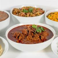 Birria Family Pack · Slow cooked beef pot roast is simmered in a blend of chilies and spices served with arroz, f...