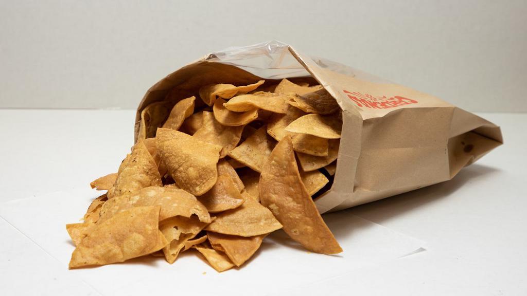 Chips De Tortilla Casera · Bag of crispy corn tortilla chips perfect appetizer for any of our meals (1 lb)