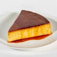 Flan · A 9oz slice of flan made with sweetened egg custard and a caramel topping.