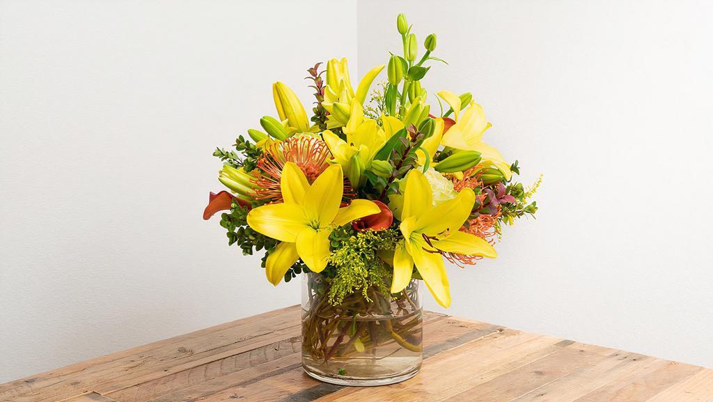 Seasonal Arrangement In A Vase · Match your home and office design to the natural world with a splash of seasonal variety!

-- Picture represents the Large version of this arrangement --

Seasonal options will vary throughout the year and depending on location. Our florist will provide the best available flowers for your order!
