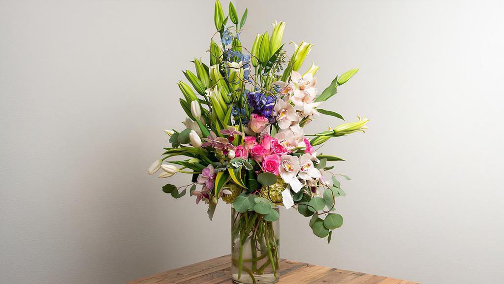 Deluxe Arrangement In A Vase · An extravagant luxurious arrangement of seasonal flowers.