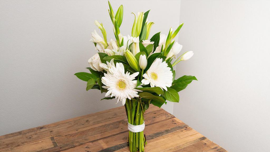 White, Ivory, Cream, Beige Wrapped Bouquet · Seasonal options may vary throughout the year and depending on location. Our florist will provide the best available flowers for your order!