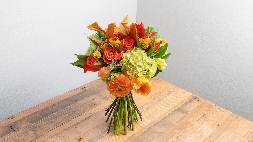 Fall Themed Wrapped Bouquet · Our Fall Bouquet bring seasonal colors, warmth and scents to your home. This Item is available until November 30th  

** Picture represents the Large version of this arrangement/Seasonal options will vary throughout the year and depending on location. Our florist will provide the best available flowers for your order.**