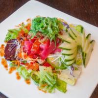 Hawaiian Poke Salad · Ahi tuna with spiced sesame dressing on mixed greens and seaweed salad.