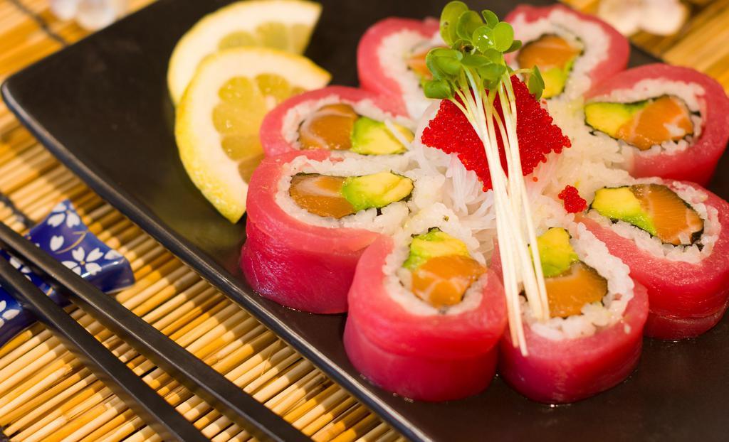 Cherry Blossom Roll · Salmon and avocado with tuna on top.