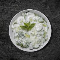 Yogurt Salad (8 oz) · Our fresh home-made salt strained yogurt and topped with cucumbers, garlic, and olive oil.