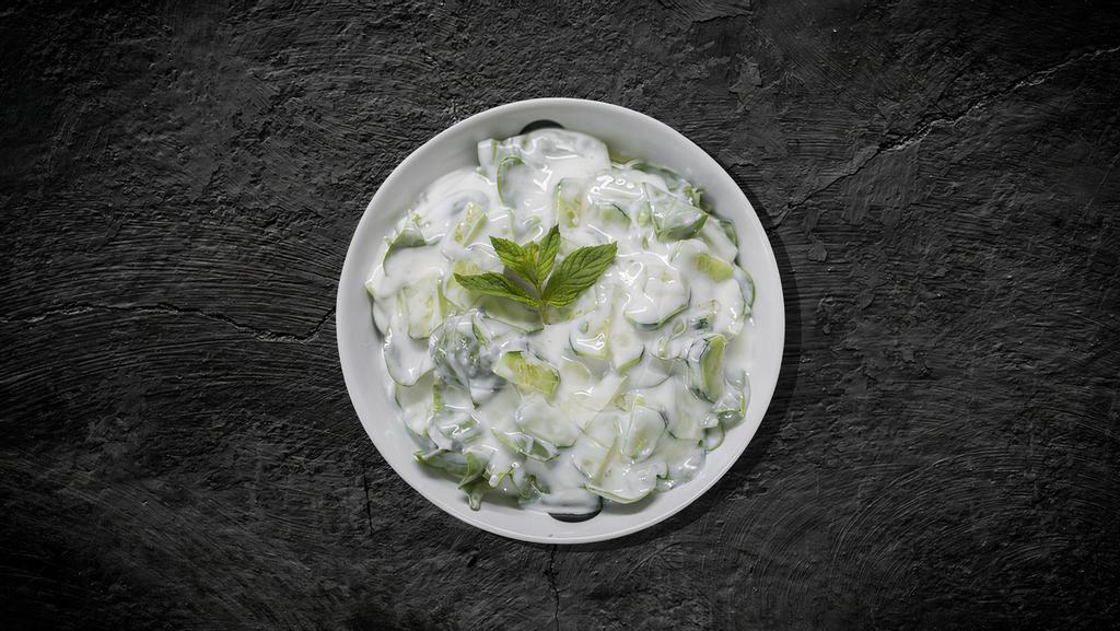 Yogurt Salad (8 oz) · Our fresh home-made salt strained yogurt and topped with cucumbers, garlic, and olive oil.