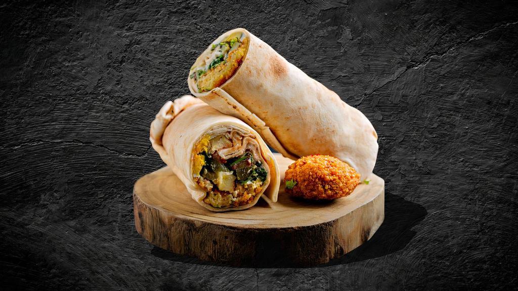 Ultimate Falafel Sandwich · A flavorful vegetarian favorite; a deep fried blend mix of chickpeas, onions, parsley, garlic, and special spices. Includes lettuce, tomato, pickles, and hummus.