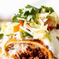 Super Wet Burrito · Choice of meat, topped with green or red sauce, beans, rice, guacamole, sour cream, onion, c...
