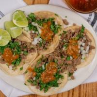 Street Tacos · Choice of meat, soft corn tortilla, onion, cilantro, and salsa.