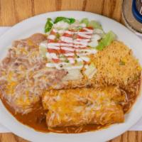 Enchiladas Nuevo Mexico · Two red corn enchilada with choice of meat, sides of beans, rice and salad.
