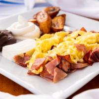 Breakfast Plate · Scrambled eggs, black beans, queso fresco, plantains, sour cream and tortillas.