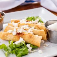 Flautitas · Four mini crispy corn tortillas filled with chicken, fresh pico de gallo, shredded lettuce, ...
