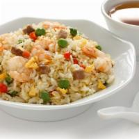 Hong Kong Style Fried Rice · Delicious and authentic rice with marinated BBQ pork, chicken and fresh pineapple.