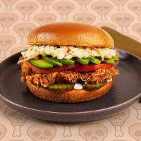 Deluxe Fried Chicken Sandwich · Crispy fried chicken breast with tomatoes, coleslaw, and ranch on a buttery brioche bun.